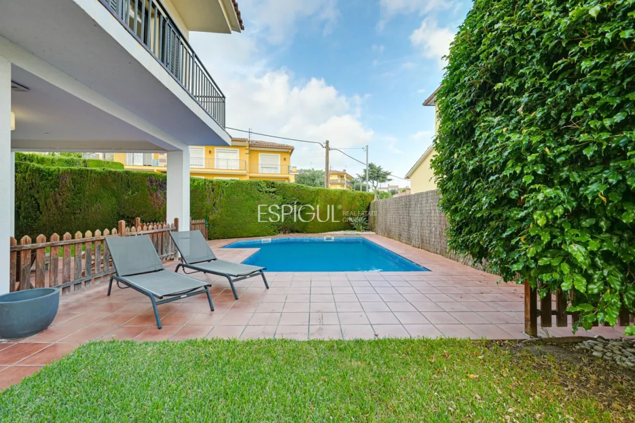 Elegant Two-Story House with a Flat Garden and Private Pool