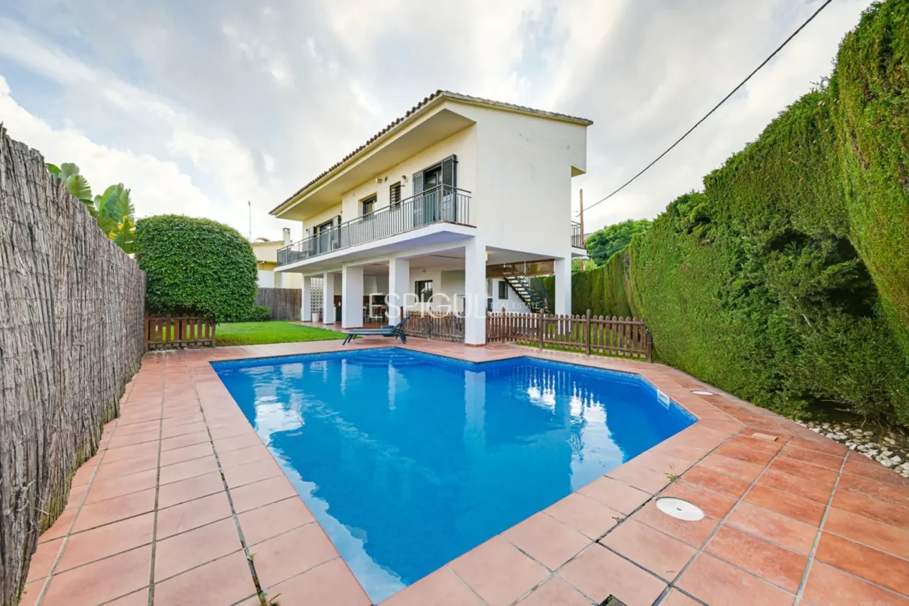 Elegant Two-Story House with a Flat Garden and Private Pool